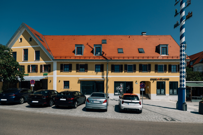 Linea Apartments: renovated town house with new windows and shopfronts